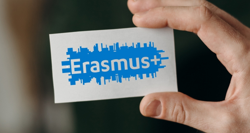 Hand holding card with Erasmus program logo